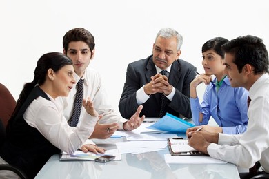 Professionals discussing together in a meeting