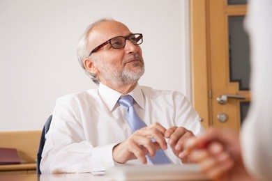 Senior male business executive in a meeting