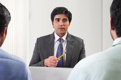 Three businessmen in meeting