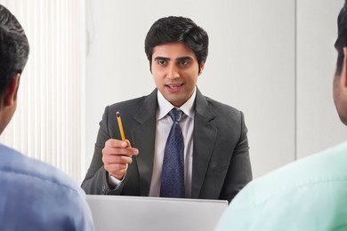 Three businessmen in meeting