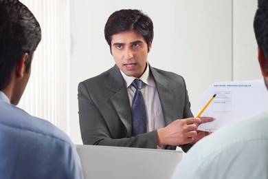 Three businessmen in meeting