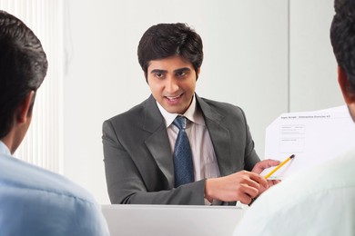 Three businessmen in meeting