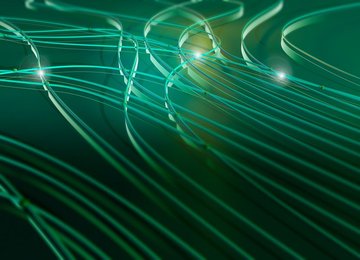 Abstract green pattern of light flowing through interconnecting cables