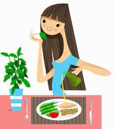 Woman smelling fresh herb with healthy meal