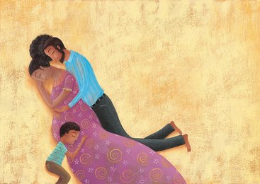 Happy father and son embracing pregnant mother