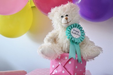 Happy birthday badge on a teddy bear