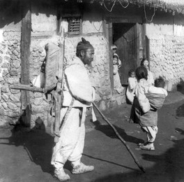 Korea: A happy family in thatched hut of a Korean peasant, Seoul, early 20th century