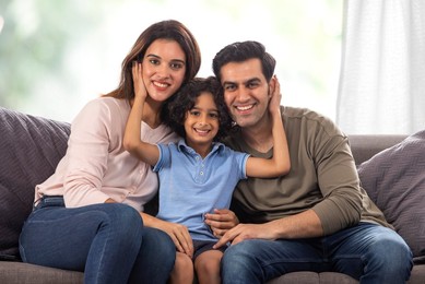 Portrait of a happy family looking together at camera with smile