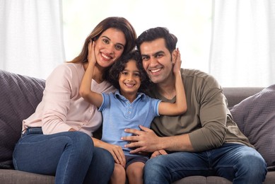 Portrait of a happy family looking together at camera with smile