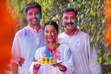 Happy Family celebrating Holi together