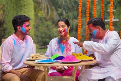 Happy Family celebrating Holi together