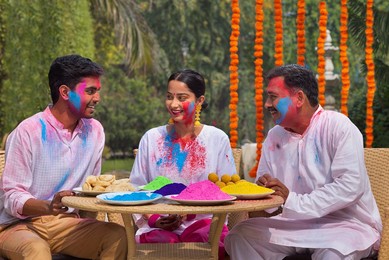 Happy Family celebrating Holi together