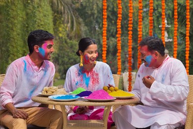 Happy Family celebrating Holi together