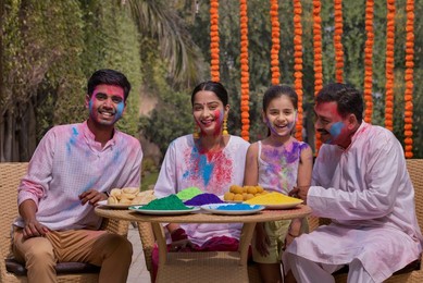 Happy Family celebrating Holi together