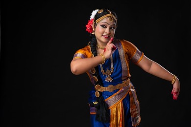 Kuchipudi dancer in Shringar rasa depicting the mischievous nature of Lord Krishna