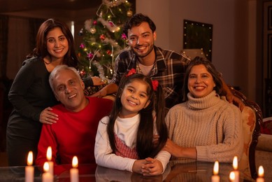 Happy family celebrating Christmas together in living room