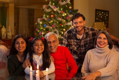 Happy family celebrating Christmas together in living room