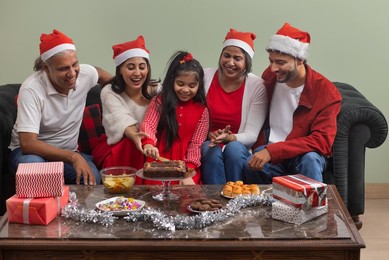 Portrait of happy family celebrating Christmas at home