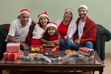 Portrait of happy family celebrating Christmas at home