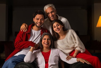 Portrait of happy family together in living room