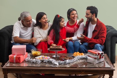 Portrait of happy family celebrating birthday at home
