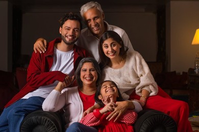 Portrait of happy family together in living room
