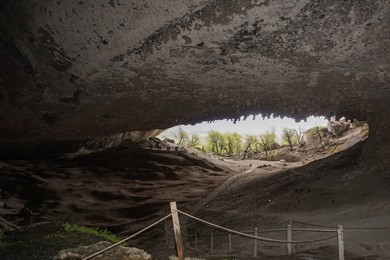 Milodon. cave. natural. monument. landscape. people. horizontal. puerto Natales. cile. patagonia. south America. natural Beauty. natural Park. nature. argentina. outdoor. outdoors. outside