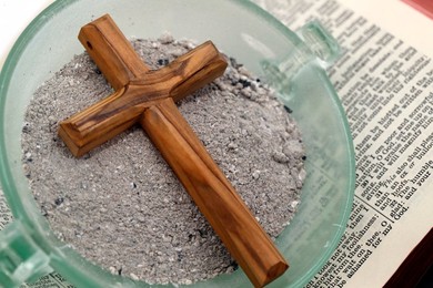 Ashes, cross and bible. Ash Wednesday celebration. Lent season.