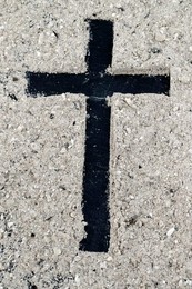 Ashes and wooden christian cross. Ash Wednesday celebration. Lent season.