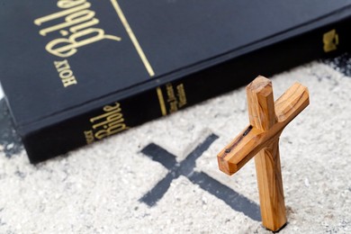 Ashes, cross and bible. Ash Wednesday celebration. Lent season.