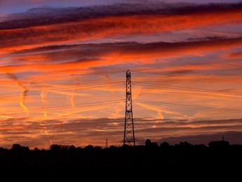 Electricity pylons and street light  in Lower Radley at dawn