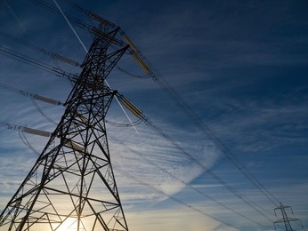 Immense electricity pylon in Kennington, South Oxford at sunrise