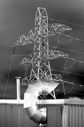 Giant electricity pylon and factory plumbing in Sandford industrial estate, abstract visualization