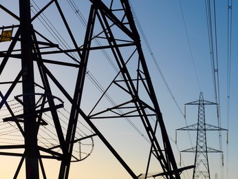 Giant pylon in a field in Sandford Village, winter sunrise