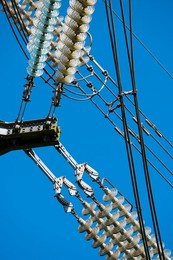 Close-up of high voltage insulators on an electricity pylon by Sandford industrial estate