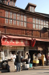 The north-eastern districts of the city of Shanghai: the traditional Shikumen houses surrounded by high-rise buildings. Shanghai, China, Asia