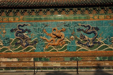 The Nine Dragon Wall at Beihai Park covered in tiles. Beijing; China