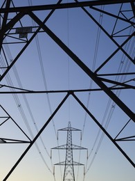 Giant pylon in a field in Kennington Village, winter sunrise