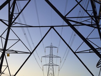 Giant pylon in a field in Kennington Village, winter sunrise