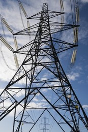 Giant pylon in a field in Kennington Village, spring morning