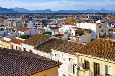 Denia, Spain, View from the historic military fortress into the city center. High angle scene of the cityscape in travel destination in the Alicante province.