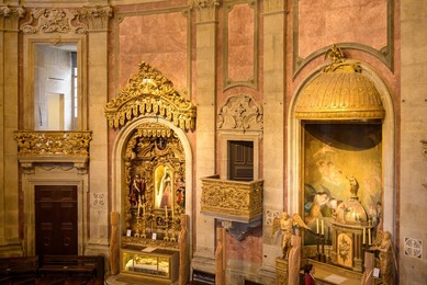 Porto, Portugal, Clerigos Church and Tower. An interior balcony is by two religious saints altars. The oval temple nave is a major travel destinations in the city.