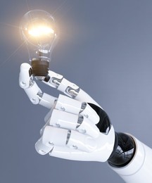 Robot holding an illuminated light bulb showing an AI idea concept 3d render