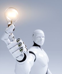 Robot holding an illuminated light bulb showing an AI idea concept 3d render