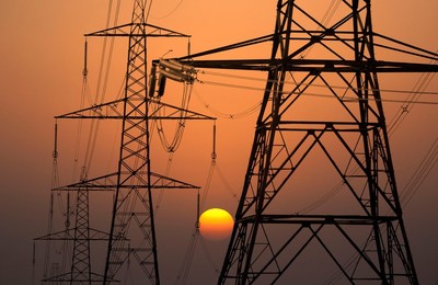 Electricity pylons in Kennington, South Oxford at sunset