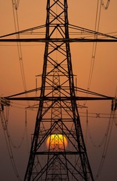 Electricity pylons in Kennington, South Oxford at sunset