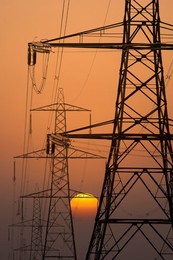 Electricity pylons in Kennington, South Oxford at sunset