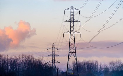 Electricity pylon in a field in Lower Radley, winter sunrise