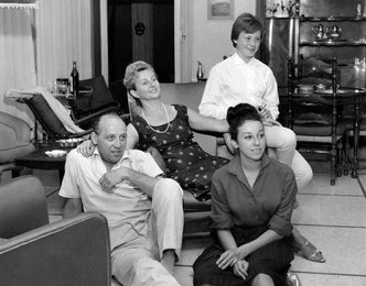 The Beneck family in the living room of their house