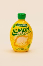 A container of Concord Foods Lemon Juice on a white background.